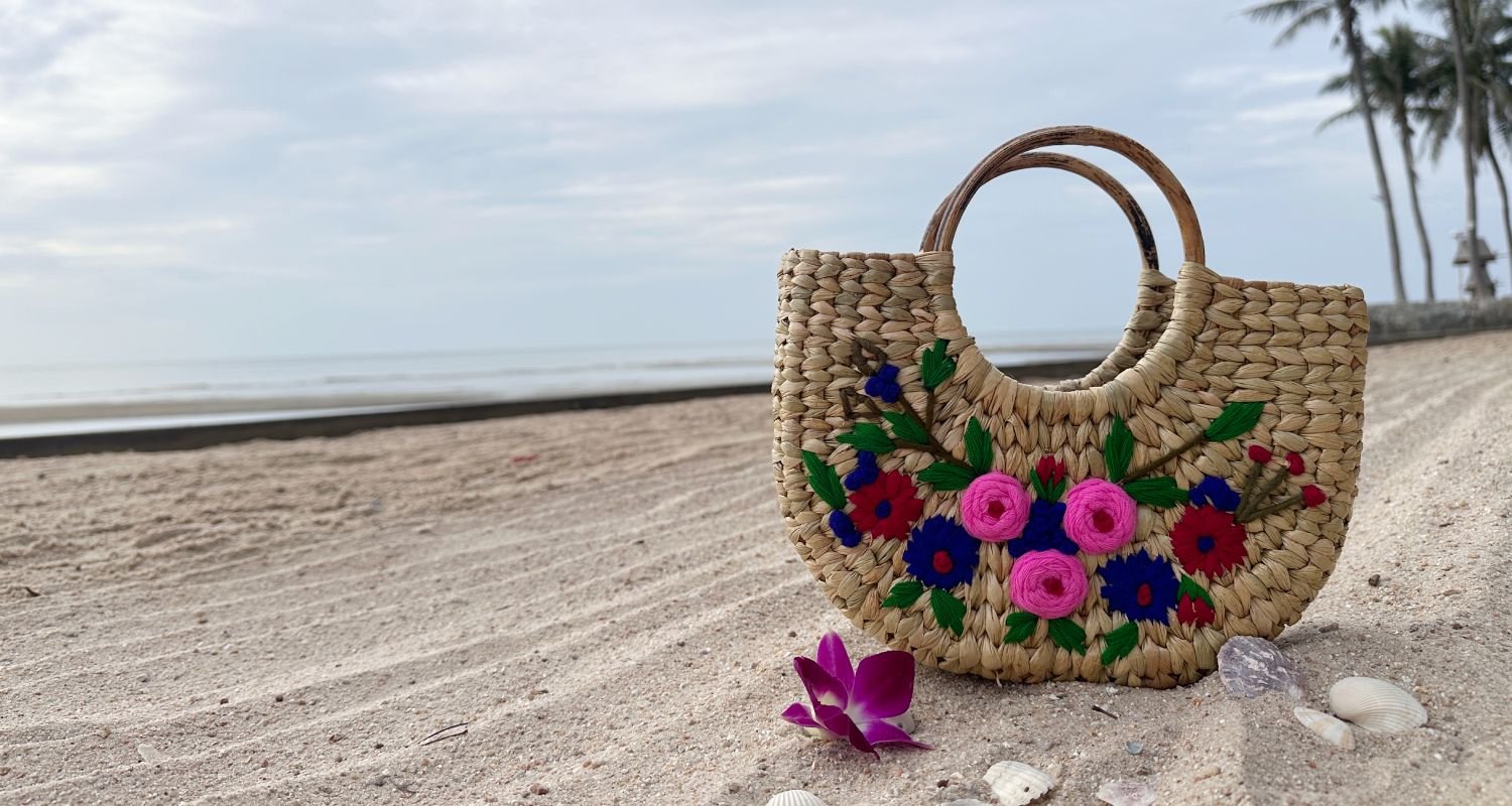 Handwoven pearl reed handbag